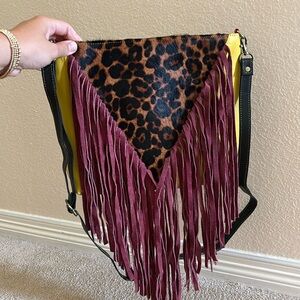 Never used fringe cross body. Upcycled leather